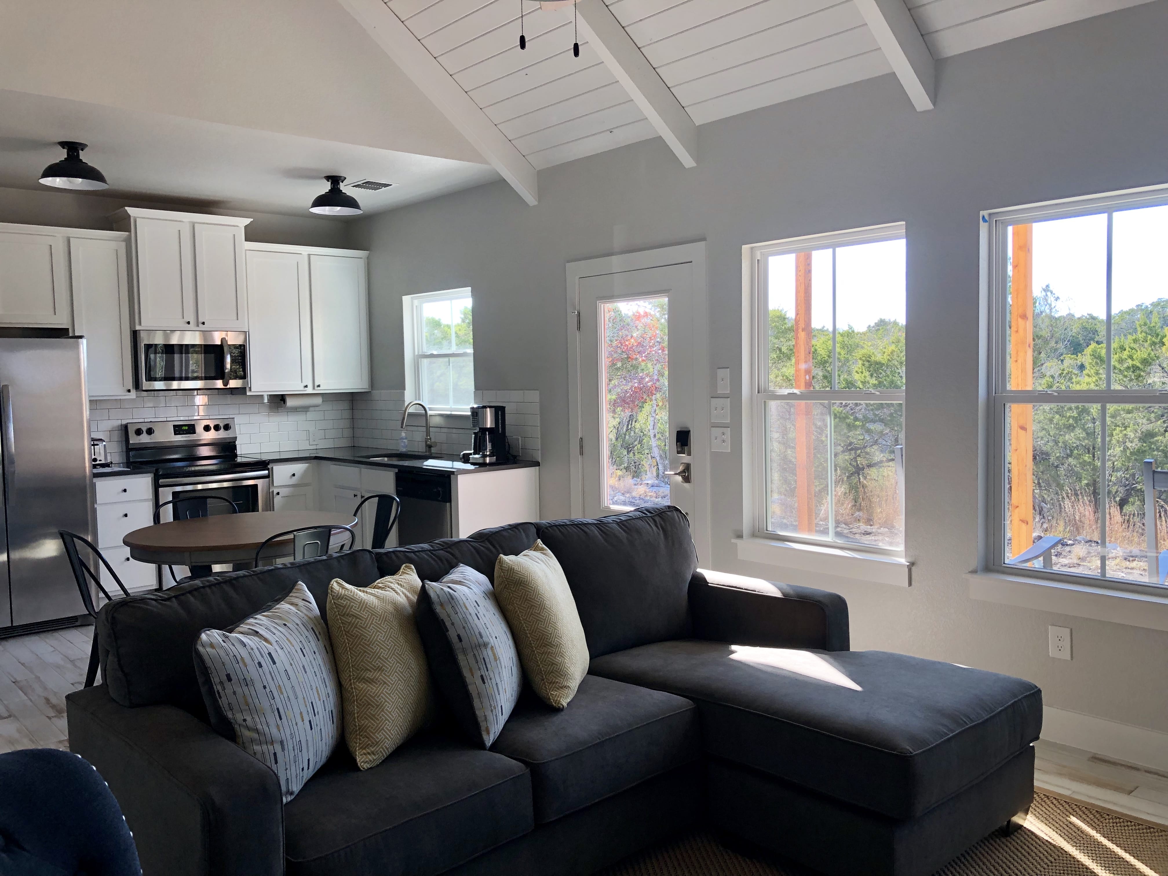 Living room with canyon views inside Jackrabbit Cottage Wimberley